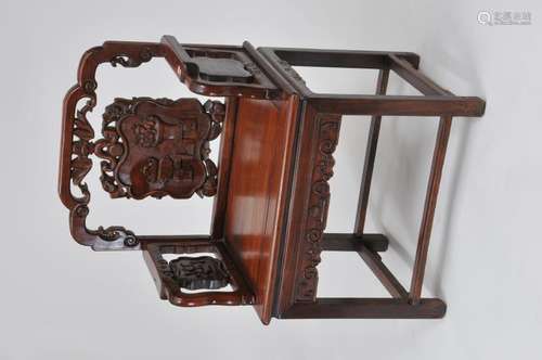 Rosewood  chair. China. 19th century. Surfaces carved with 