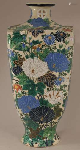 Pottery vase. Japan. Meiji period. (1868-1912). Satsuma ware. Flowers in various coloured blues, white and green. Signed.   19