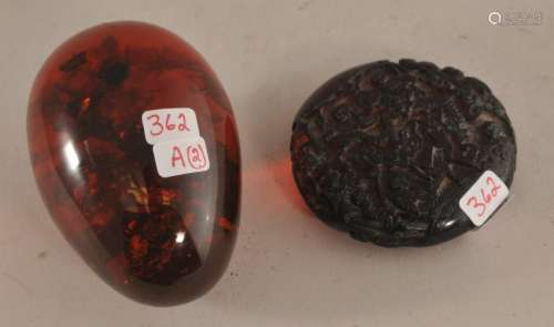 Two Amber carvings. An egg with insects and a pendant with carved figures. (1) egg shape. 2-3/4