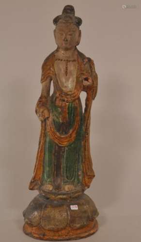 Pottery figure. China. Ming period. (1368-1644) San Tsai ware. Standing figure of Kuan Yin. Losses.  15 1/2