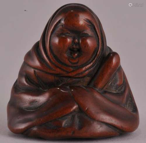 Boxwood Netsuke. Japan. 18th century. Figure of Okame. Signed.  1-1/2