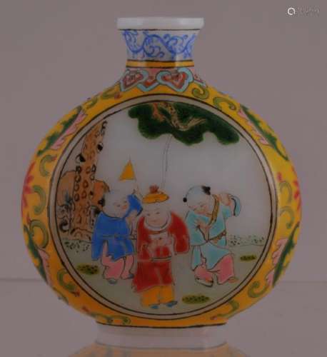 Glass snuff bottle. China 20th century. Enameled decoration of children playing. Yellow floral borders. Ku Yueh Hsuan mark on the base.  2-3/4