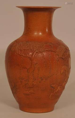 Republic period carved rust ground porcelain vase with relief decoration of horses in a landscape. Inscription on side. Marked on base. Chip on rim and branch in landscape. 12-1/2