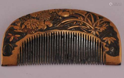 Ornamental comb.  Japan. 19th century. Carved horn. Surface decorated with flowers and gold lacquer. 3-3/8