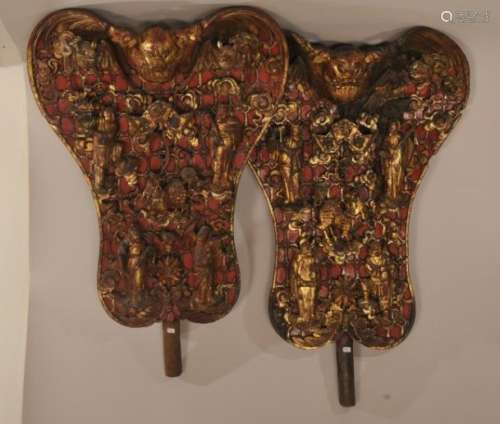 Pair of carved wooden fans. China. 19th century. High relief carving of bats, the immortals and auspicious characters. Surface of gold, red and black lacquer.  17
