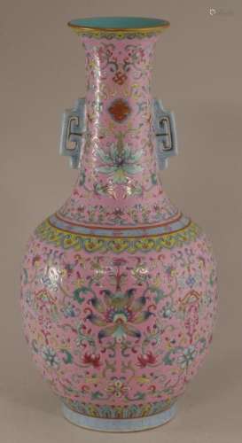 20th century Chinese pink ground porcelain two handled vase with floral scroll decoration. Turquoise interior and base. Jia Qing mark on base. 12-1/2