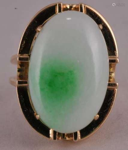 Chinese natural color oval shape white with apple green variegated Jadeite Cabuchon and 18 kt gold ring. Tested as natural color and no indications of impregnation. GIA report dated 8/22/18. Stone measures 22.6 x 14.9 x 6.6 mm. Not hallmarked. Tested as 18 kt gold. Total weight - 12.1 grams.