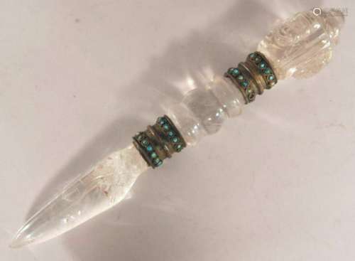 Tantric ritual object. Tibet. 19th century. Phurba of rock crystal with brass mounts set with turquoise.  12-1/4