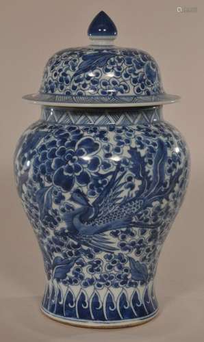 Porcelain covered jar. China. 19th century. Underglaze blue decoration of phoenixes and peonies.  11-1/2