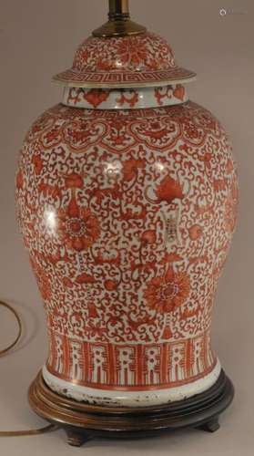 Late 19th century large Chinese iron red decorated porcelain jar and cover. All-over floral scroll and bat decoration. Mounted as a lamp. Height of jar- 16-1/2