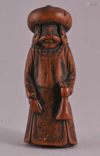 18th century Japanese carved wood Netsuke of a European figure holding a pouch.                 2-3/4