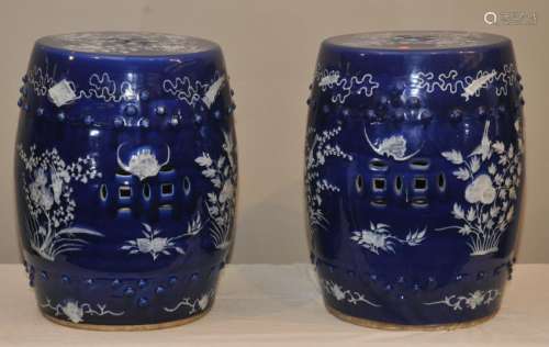 Pair of porcelain garden seats. China. 19th century. Pate sur Pate decoration of white on a blue ground. Drum shaped. 20