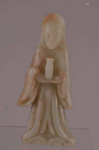 Jade carving. China. 19th century. Standing figure of Kuan Yin holding a vase. 5