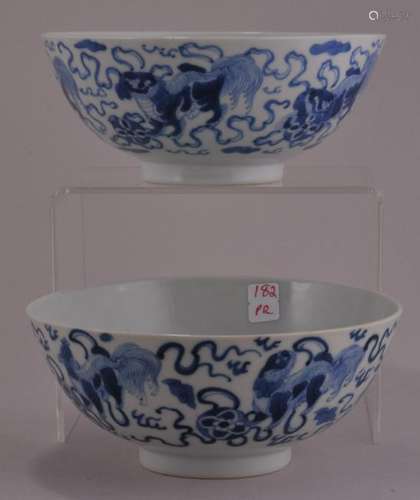 Pair of porcelain bowls. China. Late 19th to early 20th century. Underglaze blue decoration of foo dogs with brocade balls.  5-3/8