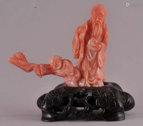 Republic Period Chinese red and white coral carving of Shaolao in a carved wood fitted stand. Overall height- 4