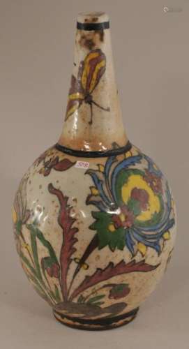 Pottery bottle. Persia. Early 20th century. Polychrome decoration of flowers.   11-3/4
