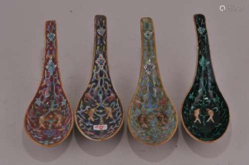 Four porcelain spoons. China. 19th to early 20th century. Raised double fish with floral scrolling.  5 3/4