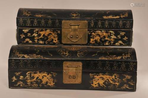 Pair of pillow boxes. China. 20th century. Pigskin. Black lacquer with gold decoration. Domed top. Brass mounts.   17-3/4