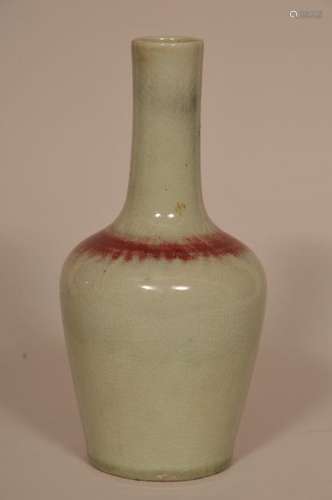 Porcelain vase. China. Ch'ien Lung mark but 19th century. Hanging gall shaped. Peach bloom glazze of celadon with areas of red.  9 1/4