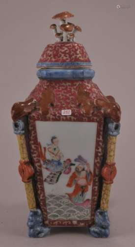Porcelain covered jar. China. 20th century. Square sided with phoenix and jewel corners. Cover with mushroom finial. Famille Rose decoration of The Immortals. Ch'ien Lung mark on the base.  12
