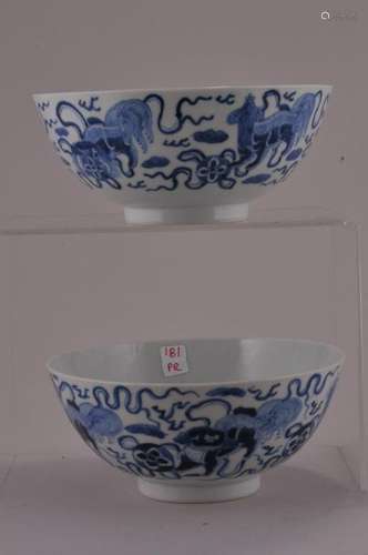 Pair of porcelain bowls. China. Late 19th to early 20th century. Underglaze blue decoration of foo dogs with brocade balls.  5-3/8