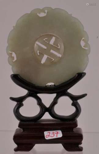 Jade pendant. China. 19th century. Pi form with a moveable center. Green celadon colour.  Plaque- 2-1/2