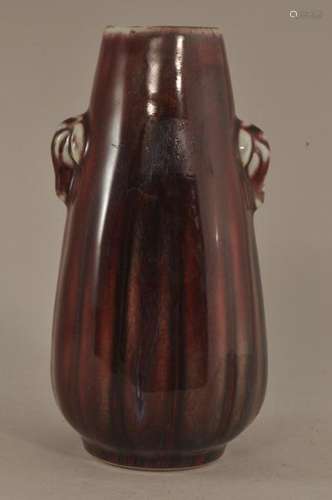 Porcelain vase. China. 20th century. Elongated pear shape. Elephant head handles. Aubergine glaze.  5-1/2