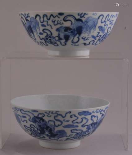 Pair of porcelain bowls. China. Late 19th to early 20th century. Underglaze blue decoration of foo dogs with brocade balls.  5-3/8