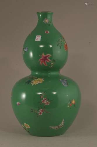 20th century Chinese green ground double gourd shape vase with flower and butterfly decoration. Turquoise interior and base. Jia Qing mark on base. 12