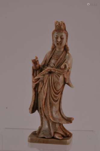 Soapstone carving. China. 20th century. Standing figure of Kuan Yin. Grey coloured stone.  5-1/2