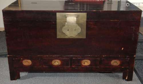 Elmwood storage cabinet. China. 19th Century. Lift top, 4 drawers. Surface with burgundy lacquer. Brass mounts 37