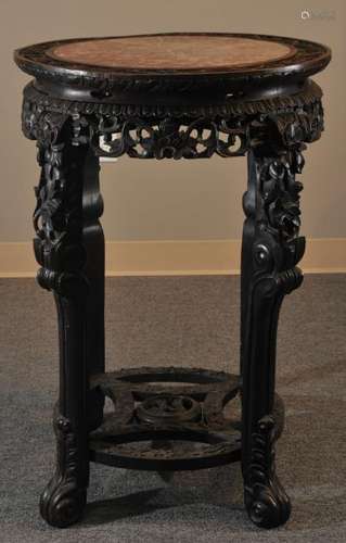 Occasional table. China. 19th Century. Circular form, rosewood carved and pierced with floral marble inset top.  32