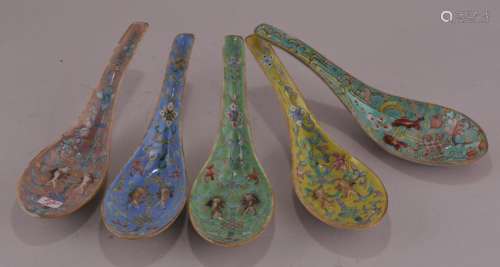Five porcelain spoons. China. 19th to early 20th century. Raised double fish with floral scrolling.  5 3/4