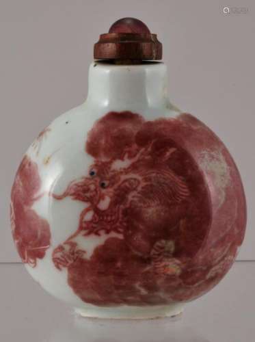 Porcelain snuff bottle. China. 19th century. Decoration of dragons in underglaze red. 2-1/2