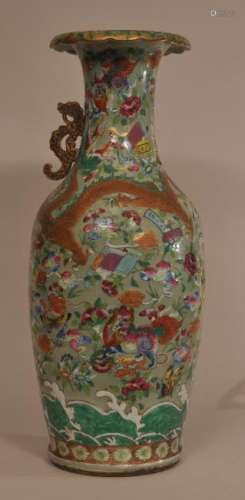 Porcelain vase. China. 19th century. Export ware. Dragon handles (one missing). Relief decoration of dragons, mythical animals and flowers in Famille Rose enamels on a celadon ground.