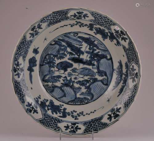 Large Chinese Ming Dynasty Swatow blue and white porcelain deep dish with birds in landscape and floral decoration. Scalloped rim. 14-3/4