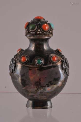 Silver snuff bottle. China. Early 20th century. Mongol style. Inlay of coral and turquoise. 2-3/4