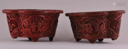 Pair of 19th century Chinese carved Cinnebar trefoil shaped footed planters with scenic medallions and floral scroll decoration. One foot missing. Two feet with loss. 6-1/2