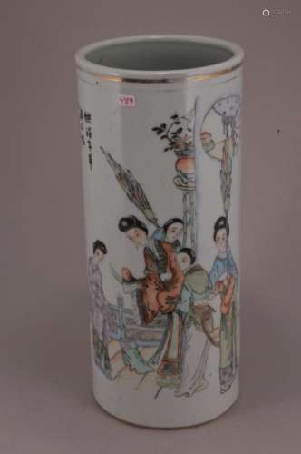 Porcelain hat stand. China. Circa 1930. Enameled decoration of women and a poem. Cylindrical form.   11-1/4
