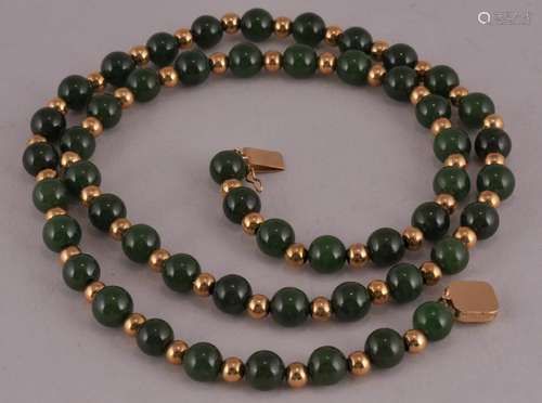 14 kt Gold and Spinach green jade bead necklace. 51 jade beads -(Approx. 8 mm). 50 gold beads total. 25