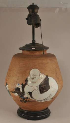 Stoneware jar. Japan. 19th century.  Glaze decoration of Hoeitei and attendant. Drilled and mounted as a lamp. Vase- 11