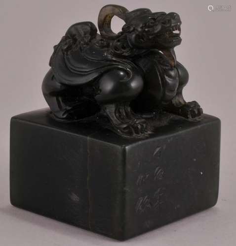 Jade seal. China. 20th century. Dark forest green stone. Mythical animal finial. Seal intact. 3-3/4