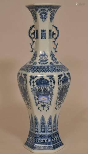 20th century Chinese under glaze blue and white decorated Ming style hexagonal porcelain two handled vase. Double fish decorated panels and geometric borders. Chien Lung mark on base. 14