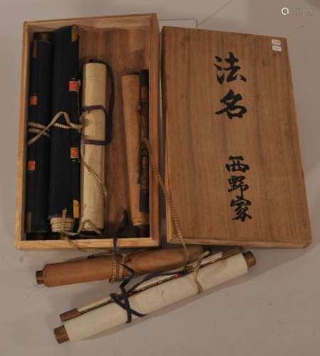 Lot of twelve items. Japan. Early 20th century. To include: Six silk wallets and six hanging scrolls (souvenirs) of various Shinton and Buddhist shrines.