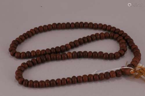 Carved sandalwood Buddhist rosary beads. China. 19th century. Surface carved with flowers.  17-1/2