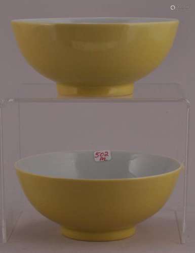 Pair of porcelain bowls. China. Early 20th century. Lemon yellow glaze. Ch'ien Lung mark on the base in underglaze blue.   4 5/8