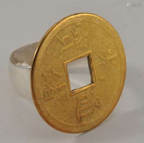 Chinese gold coin mounted as a ring. Tests as 9K, silver shank. Total weight 5.7 grams.  7/8