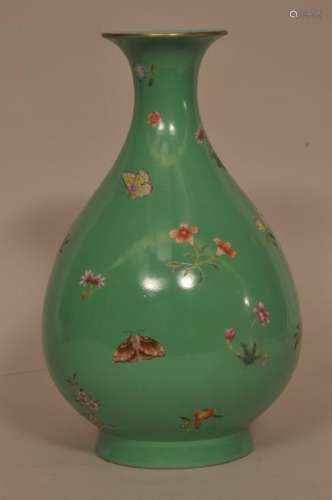 20th century green ground Chinese pear-shaped porcelain vase with butterfly and floral decoration. Turquoise interior and base. Jiaqing mark on vase. 12