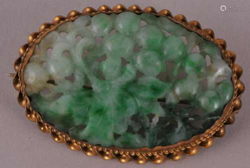 Gold oval carved Apple Green Jadeite pin. Grapes and grape leaf decoration. 1-5/8