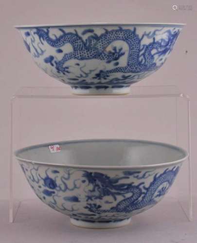 Pair of porcelain bowls. China. 19th to early 20th century. Underglaze blue decoration of dragons and pearls. K'ang H si mark.   6-3/8